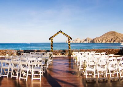 A wedding setting with the iconic Cabo San Lucas Arch in the background.